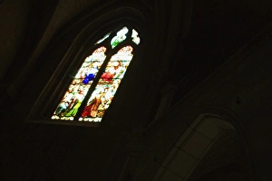 Low angle view of a stained glass window in a church, Church Of St. Pierre, Bordeaux, Aquitaine, France Low angle view of a stained glass window in a church, Church Of St. Pierre, Bordeaux, Aquitaine, France