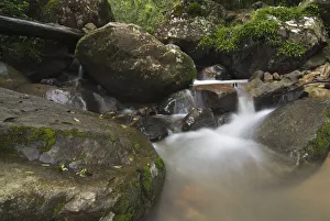 Low angle view of a waterfall with blurred water, Injisuthi National Park Low angle view of a waterfall with blurred water, Injisuthi National Park