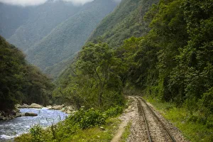 Machu Picchu-Cusco Railway running along Urubamba River, Cusco Region, Peru Machu Picchu-Cusco Railway running along Urubamba River, Cusco Region, Peru