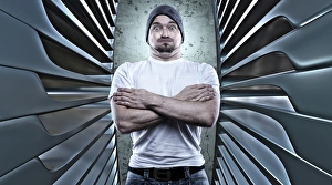 Man posing like a macho with his arms crossed Man posing like a macho with his arms crossed