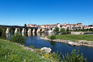 Millau/ France old town at Tarn River - Historic bridge and the Millau Viaduct Millau/ France old town at Tarn River - Historic bridge and the Millau Viaduct