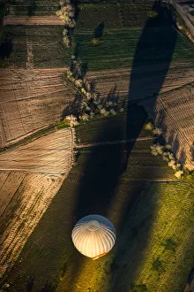 Morning balloon over the field in aerial view Morning balloon over the field in aerial view
