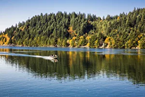 Motor Speed Boat and Passengers glides fast on water, Columbia River Gorge, Hood River Motor Speed Boat and Passengers glides fast on water, Columbia River Gorge, Hood River