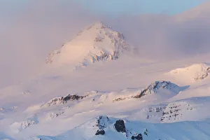 Mountains near glacier glowing in dawns light, Vatnajokull Glacier, Skaftafell National Park, Southwest Iceland Mountains near glacier glowing in dawns light, Vatnajokull Glacier, Skaftafell National Park, Southwest Iceland