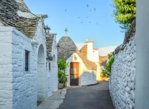 Narrow alley with trulli houses in Alberobello Narrow alley with trulli houses in Alberobello
