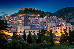 Nighttime view over the colourful town of Bosa and its medieval castle along the Temo Nighttime view over the colourful town of Bosa and its medieval castle along the Temo
