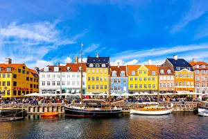 Nyhavn harbour and multicolored vibrant houses along the canal, Copenhagen, Denmark Nyhavn harbour and multicolored vibrant houses along the canal, Copenhagen, Denmark