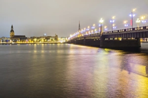 Old Riga skyline at night and Akmens bridge over Daugava river. Riga, Latvia Old Riga skyline at night and Akmens bridge over Daugava river. Riga, Latvia