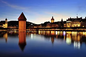 Old town of Lucerne with Kapellbrucke bridge, Wasserturm tower and the Reuss river, at dusk, Lucerne, Canton of Lucerne Old town of Lucerne with Kapellbrucke bridge, Wasserturm tower and the Reuss river, at dusk, Lucerne, Canton of Lucerne
