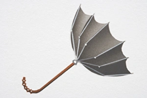 Open umbrella blown upwards from convex into concave shape by strong wind, side view Open umbrella blown upwards from convex into concave shape by strong wind, side view