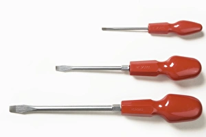 Three orange handled slot-headed screwdrivers Three orange handled slot-headed screwdrivers
