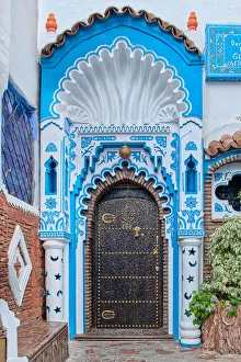 An ornate blue and white doorway in the Blue City of Chefchaouen An ornate blue and white doorway in the Blue City of Chefchaouen