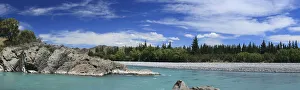Palm trees -Arecales- and forest on the rocky banks of the Waiau River, panorama, Waiau, South Island, New Zealand Palm trees -Arecales- and forest on the rocky banks of the Waiau River, panorama, Waiau, South Island, New Zealand