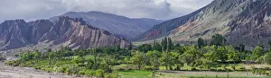Panoramic, lush vegetation at the Purmamarca river, behind Cerro de los Siete Colores or Panoramic, lush vegetation at the Purmamarca river, behind Cerro de los Siete Colores or