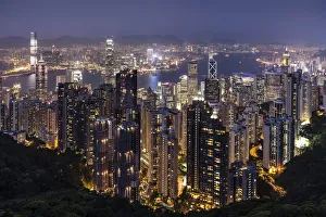 Panoramic view from Victoria Peak across the high-rise buildings at night, Central District, Hong Kong, China Panoramic view from Victoria Peak across the high-rise buildings at night, Central District, Hong Kong, China