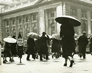 Pedestrians walking in rain in New York City, (B&W) Pedestrians walking in rain in New York City, (B&W)