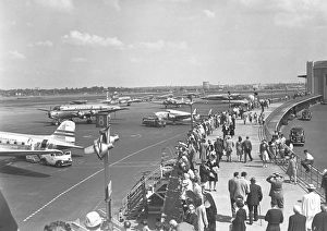 People walking on airpotrt, (B&W), elevated view People walking on airpotrt, (B&W), elevated view