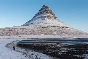 A photographer and Mt. Kirkjufell, Iceland A photographer and Mt. Kirkjufell, Iceland