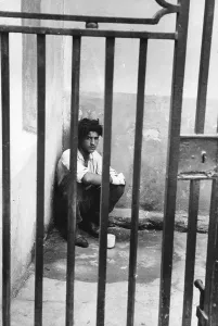 Isolated Male Figure Prints: Behind Bars