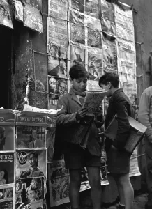 Italian Schoolboy Reads Comic at Newspaper Stand Print
