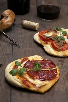 Pizzette, small pizzas with buffalo mozzarella, chorizo and coriander, front, and tomatoes and anchovies, rear Pizzette, small pizzas with buffalo mozzarella, chorizo and coriander, front, and tomatoes and anchovies, rear