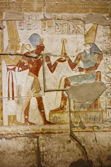 Polychromatic hieroglyphic showing The god Horus and Pharaoh Seti I at Abydos Polychromatic hieroglyphic showing The god Horus and Pharaoh Seti I at Abydos