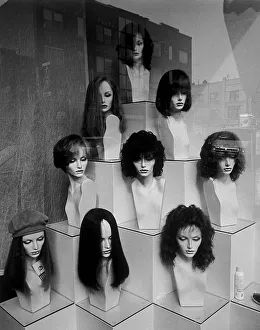 Pyramid shaped display of mannequin heads with wigs Pyramid shaped display of mannequin heads with wigs