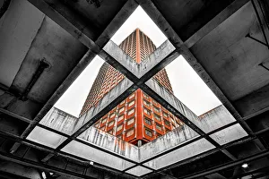 A red building seen through a concrete slab A red building seen through a concrete slab