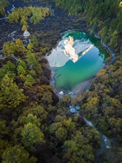 The reflection of snowy mountain on Zhuomala lake in Yading Nature Reserve, Sichuan The reflection of snowy mountain on Zhuomala lake in Yading Nature Reserve, Sichuan