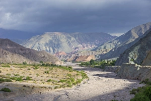 Riverbed of the Purmamarca and Cerro de los Siete Colores or Hill of Seven Colors in Riverbed of the Purmamarca and Cerro de los Siete Colores or Hill of Seven Colors in