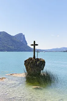 Rock with a cross, Mondsee Lake, Salzkammergut, Salzburg State, Upper Austria, Austria Rock with a cross, Mondsee Lake, Salzkammergut, Salzburg State, Upper Austria, Austria
