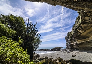 Rock formations of Trumans Cove at the beach with a waterfall, Te Miko, Trumans Bay Rock formations of Trumans Cove at the beach with a waterfall, Te Miko, Trumans Bay