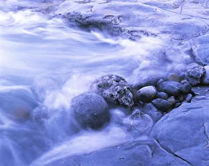 Rocks are shaped in a pool, pool with rocks, surf zone, water in motion, Burren Coast, County Clare, Ireland Rocks are shaped in a pool, pool with rocks, surf zone, water in motion, Burren Coast, County Clare, Ireland