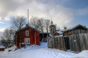 Roros old town church and wooden houses in winter Roros old town church and wooden houses in winter