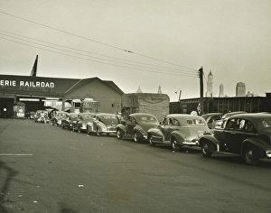 Row of cars in front of railway station, (B&W) Row of cars in front of railway station, (B&W)