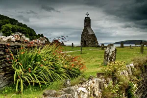 The ruins of St Brynach church at Cwm yr Eglwys on the Dinas Island peninsula between The ruins of St Brynach church at Cwm yr Eglwys on the Dinas Island peninsula between