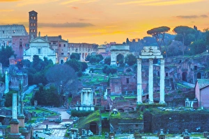 The ruins of Temple of Castor and Pollux and Arch of Titus at dawn in the Roman Forum The ruins of Temple of Castor and Pollux and Arch of Titus at dawn in the Roman Forum
