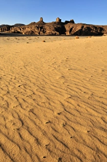Sandstone rock formation and dunes on Tasset Plateau, Tassili n'Ajjer National Park Sandstone rock formation and dunes on Tasset Plateau, Tassili n'Ajjer National Park