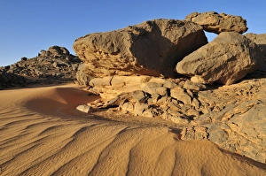 Sandstone rock formation and sand dunes, Adrar Tekemberet, Immidir, Algeria, Sahara Sandstone rock formation and sand dunes, Adrar Tekemberet, Immidir, Algeria, Sahara