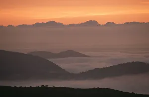 Scenic View of a Misty Mountain at Sunrise Scenic View of a Misty Mountain at Sunrise