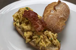 Scrambled Eggs with Fried Bacon on a Rustic Roll Print