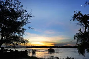 Serene view overlooking The Victoria Falls in Zambia at sunset Serene view overlooking The Victoria Falls in Zambia at sunset