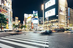 Shibuya crossing with illuminated neon signs at night, Tokyo, Japan Shibuya crossing with illuminated neon signs at night, Tokyo, Japan
