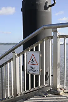 A sign Vorsicht Rutschgefahr, German for caution, slip hazard at the Hamburg harbour, Germany, Europe A sign Vorsicht Rutschgefahr, German for caution, slip hazard at the Hamburg harbour, Germany, Europe