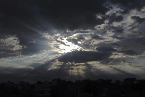 Sky with clouds and rays of sunshine, moody atmosphere Sky with clouds and rays of sunshine, moody atmosphere