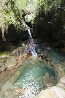 Small waterfall in Gumpe, Blue Pool in Namaza Canyon, Isalo National Park, at Ranohira Small waterfall in Gumpe, Blue Pool in Namaza Canyon, Isalo National Park, at Ranohira