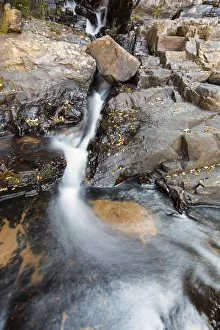 Small waterfall landscape with long exposure high in river - Dullstroom South Africa Small waterfall landscape with long exposure high in river - Dullstroom South Africa