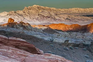 Snow covered mountains and different geological layers of rock, Valley of Fire State Park Snow covered mountains and different geological layers of rock, Valley of Fire State Park