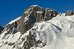 Snow-covered peaks of Le Brevent Mountain with the mountain station of the cable car Snow-covered peaks of Le Brevent Mountain with the mountain station of the cable car