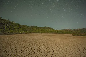 Starry sky over cracked desert, Isla San Jose, Baja California Sur, Mexico Starry sky over cracked desert, Isla San Jose, Baja California Sur, Mexico